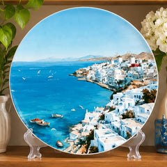 Aegean Blue Santorini Village Wall Plate on a tabletop stand