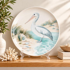 Serene Shore Pelican Wall Plate on a tabletop stand