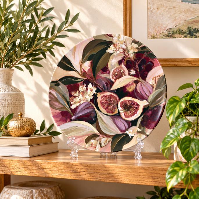 Fig & Pomegranate Harvest Wall Plate on a tabletop stand