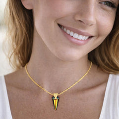 gold necklace with a triangular pendant