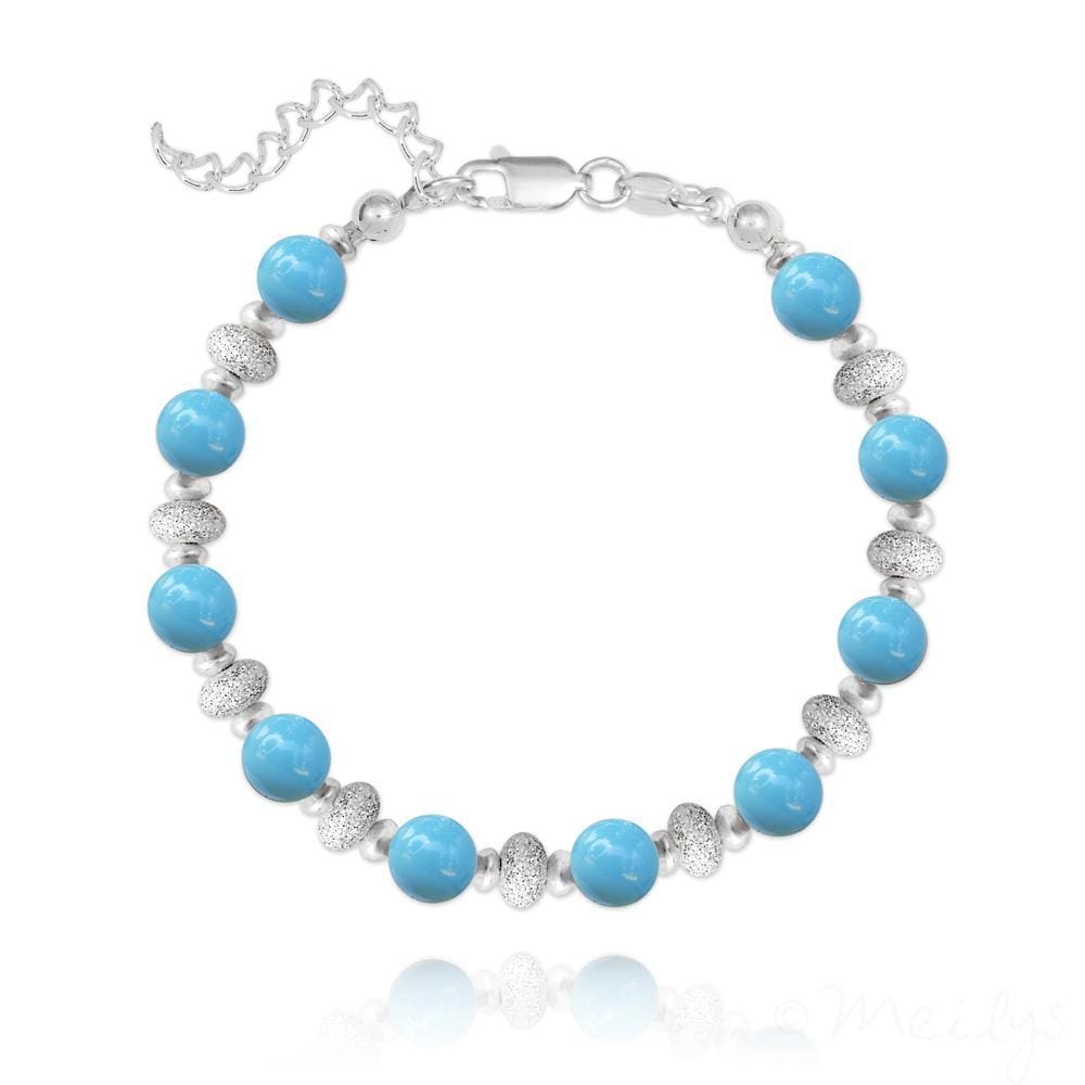 Sterling silver bracelet with round turquoise Swarovski crystal beads and textured silver spacer beads