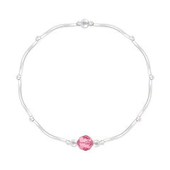 Sterling silver stretch bracelet with Light Rose pink crystal, rhodium plated finish and polished silver bead accents