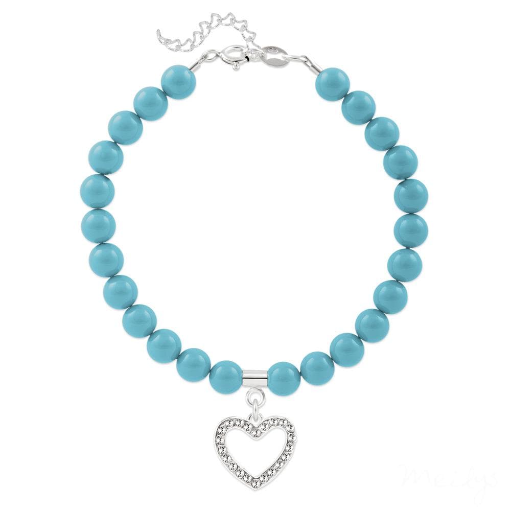 Sterling silver bracelet with smooth turquoise pearl beads, an open heart charm, clear accents and adjustable extension chain