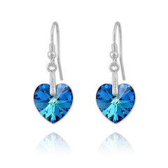 Sterling Silver drop earrings with genuine Bermuda Blue Swarovski crystal heart pendants and rhodium plated finish
