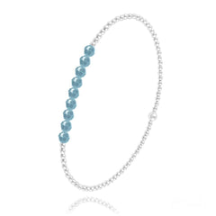 Sterling silver stretch bracelet with faceted turquoise-coloured beads and polished round silver beads