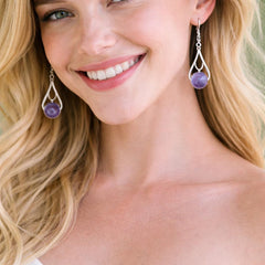 silver earrings with purple gemstones