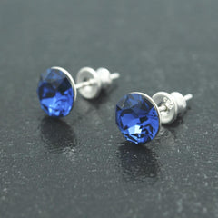 Sterling Silver sapphire blue crystal stud earrings with rhodium plated finish and round faceted crystal