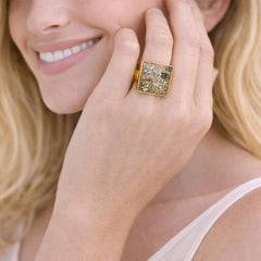 gold ring with a diamond-like stone