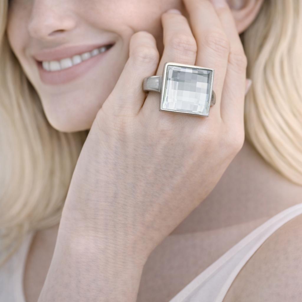 silver ring with a square gemstone