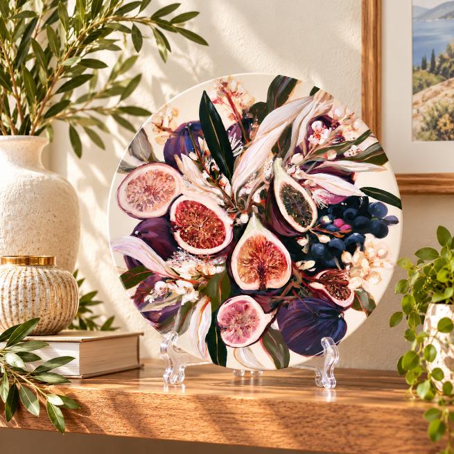 Fig & Grape Orchard Botanical Wall Plate on a tabletop stand