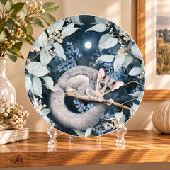 Moonlit Possum Eucalyptus Decorative Wall Plate on a tabletop stand
