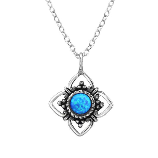 Oxidised sterling silver drop necklace with a round peacock blue druzy stone, ornate floral pendant and 45 cm chain, available in Australia.