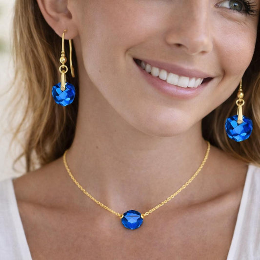 gold necklace and blue earrings