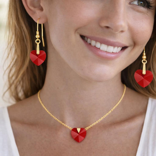 red heart-shaped earrings and a matching necklace.