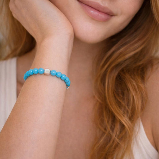 blue beaded bracelet.