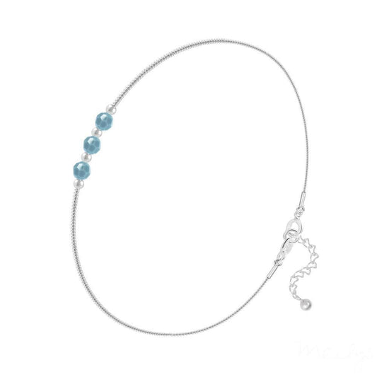 Sterling silver snake chain bracelet with three faceted turquoise crystal beads, silver spacers and an extension chain