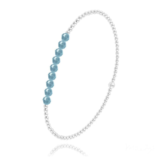 Sterling silver stretch bracelet with faceted turquoise-coloured beads and polished round silver beads