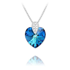 Sterling Silver heart necklace with Bermuda Blue crystal, rhodium plated finish and sparkling cubic zirconia bail