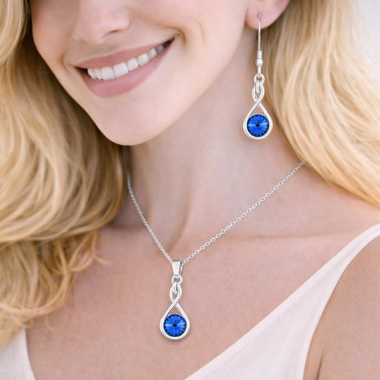 silver necklace and earrings with blue gemstones