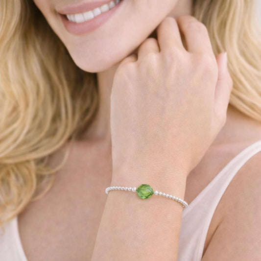  bracelet with a green gemstone