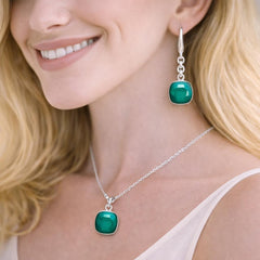 silver earrings and necklace with green gemstones