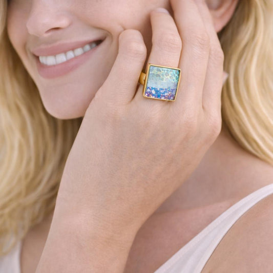 gold ring with a colorful gemstone