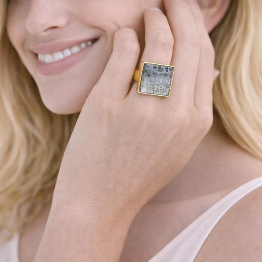  gold ring with a square gemstone 