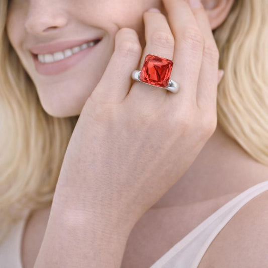 red gemstone ring with a silver
