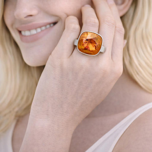 ring with an orange gemstone 